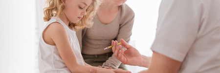 Mom and cute little boy during vaccinations at the pediatrician'sの写真素材