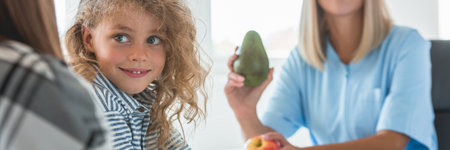 Beautiful nurse holds apple and avocado, healthy diet plan conceptの写真素材
