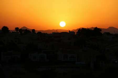 View of a mountain during a beautiful sunset in the late afternoon.の写真素材