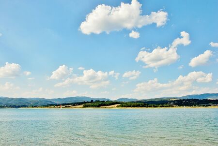 Beautiful blue ski and lake sling in tuscany italyの写真素材
