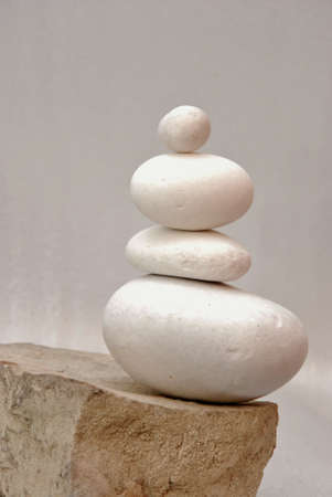 round white stones stacked, gray  background の写真素材