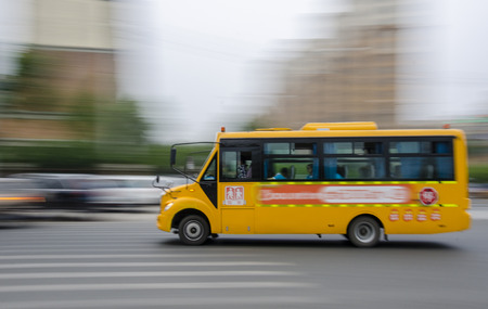 A school bus was racing along the road