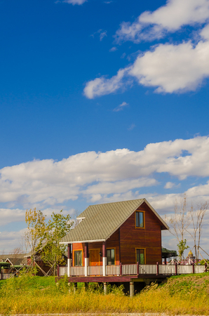 Chalet under the blue sky and white cloudsのeditorial素材