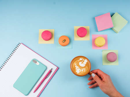 Coffee break in a colorful girly workspaceの写真素材