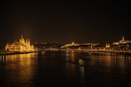 Panoramic view of Parliament building and the Danube River in Budapest, Hungary. Parliament and reflections . Evening illumination of the building.の写真素材