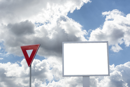 Billboard with white space Blue sky and clouds on background  Blank advertising billboardの写真素材
