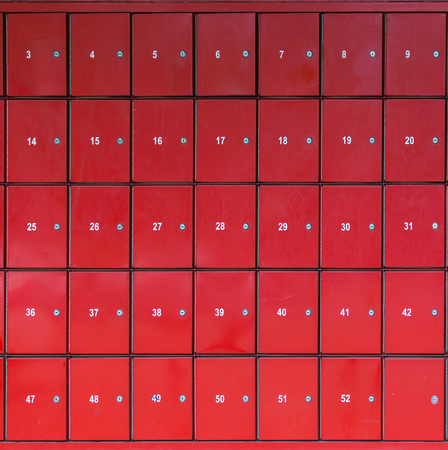 Group of red letterbox in a post office with number range. Mailbox letterbox perspectiveの写真素材