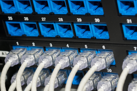 Network cables and servers in a technology data center 
Network cables in switchの写真素材