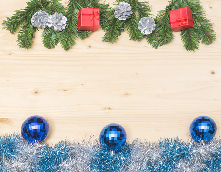 Festive Decoration and Fir branches on Wooden Christmas theme backgroundの写真素材