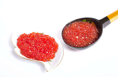 A spoon and sauser with fish roe isolated on whtiteの写真素材