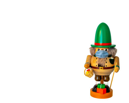 German mountain hiking nutcracker doll wearing a face maskの写真素材