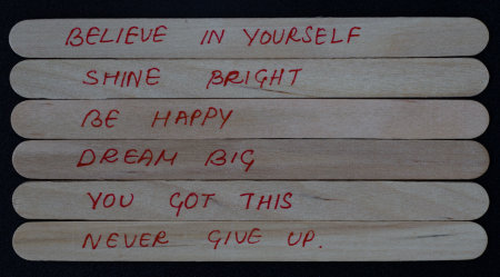 Hand written positive quotes to boost people's self esteem.