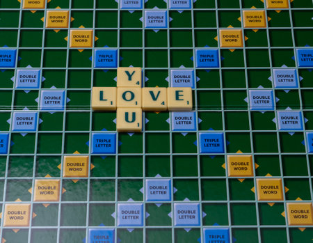 Alphabet letter arrangement of love you on a board game.の写真素材