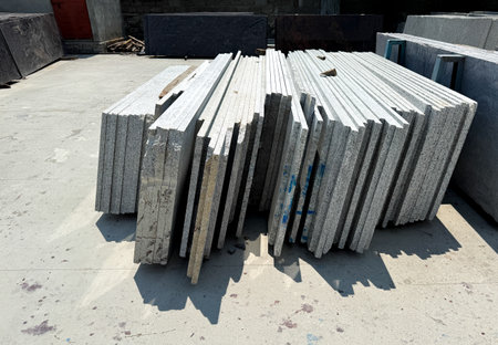 Close up shot of vertically stacked granite slabs in a factory.の写真素材