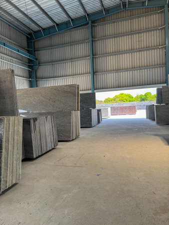 View of a granite warehouse with granite slabs stacked according to their color and textureの写真素材