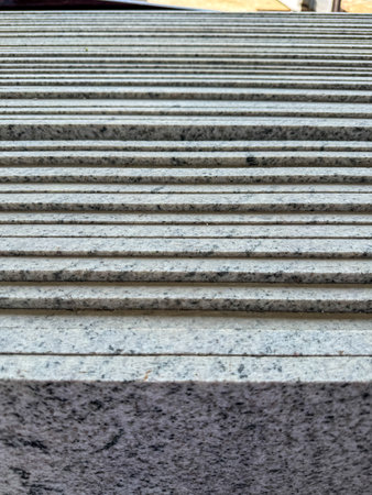 Close up shot of vertically stacked granite slabs in a factory.