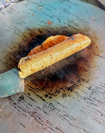 Close up shot of a roll or wrap made in a hot tawaの写真素材