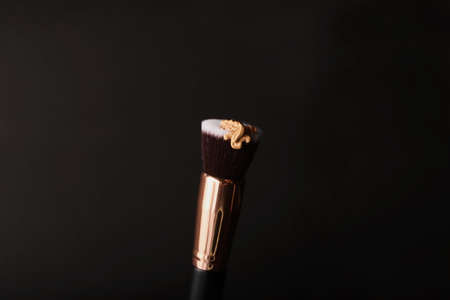 Liquid foundation lying on the make up brush for contouring.の写真素材