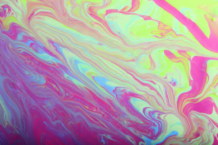 Marble background in pastel colors.Beautiful stains of liquid nail polish,fluid art technique.Pour...