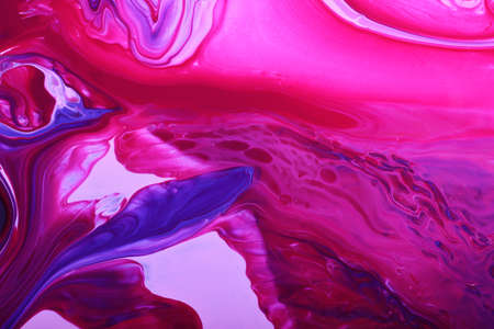 Colorful marble background.Mixed nail polishes-pink and navy blue.Beautiful stains of liquid nail polish.Modern backdrop.Good for placing text or design.Pour painting art work.Fluid art technique.の写真素材