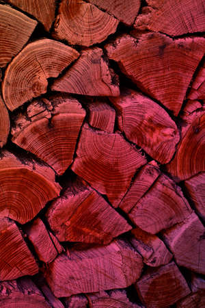 Wooden abstract background.Texture of wooden boards with aged rings.Old tree with aged rings.Firewood of various sizes and shapes.Vertical background.Gradient color.の写真素材