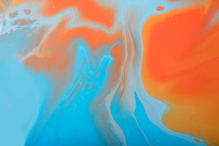 Pastel marble background with abstract stains.Mixed liquid nail polishes.Modern make up backdrop.Fluid art technique.Copy space.Pour painting art work.Macro photography.Horizontal banner.の写真素材