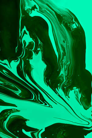 Monochrome malachite marble background.Mixed nail polishes, make up concept.Beautiful stains of liquid nail laquers.Fluid art, pour painting technique.Vertical banner.の写真素材