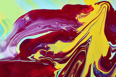 Colorful marble background.Mixed polishes-yellow, pink, blue and purple.Colorful marble...
