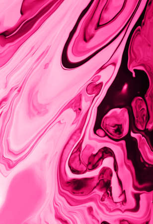 Monochrome pink marble background.Mixed nail polishes,make up concept.Beautiful stains of liquid...