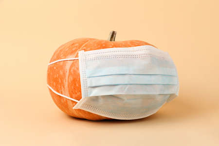 Big pumpkin in the blue medical protective maskの写真素材