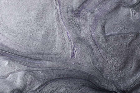 Silver metallic abstract background. Make up concept.Beautiful stains of liquid nail laquers.Fluid...