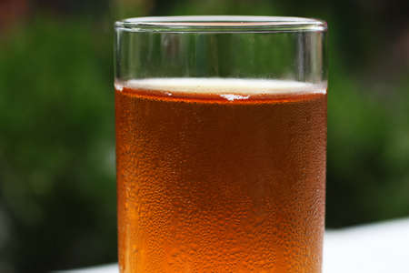 Misted glass with juice on the summer terrace.Close up photography, macro shot.の写真素材