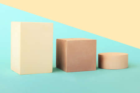 Three empty geometric podiums on the isometric background. Cosmetics or different products mockup.の写真素材