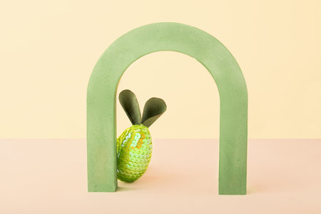 Easter minimal concept card with copy space.Funny rabbit from egg and ears hiding behind an...