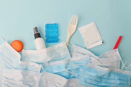 Composition from the packaging medical blue masks and plastic products.Concept of the environmental and environmental issues.の写真素材