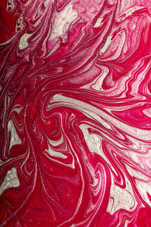 Raspberry pink shimmer abstract background. Make up concept.Beautiful stains of liquid nail laquers.Fluid art, pour painting technique.Vertical banner, can be used as backdrop for chat.の写真素材
