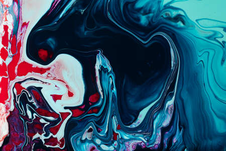 Beautiful liquid texture of the nail polish.Blue and pink colors.Multicolored background with copy...