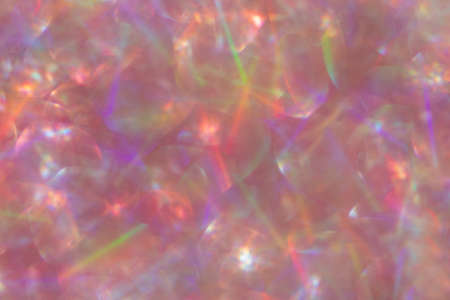 Abstract defocused pink background with shining glitter.Good as overlay layer.の写真素材