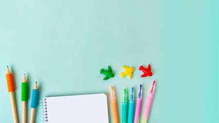 Background with different school supplies on the blue background.Back to school concept,top view,large banner.の写真素材