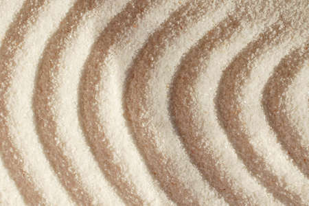 Quartz sand.Round waves on sand.の写真素材