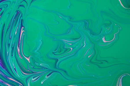 Beautiful liquid texture of the nail polish.Multicolored background with copy space.Fluid art, pour painting technique.Good as digital decor.の写真素材