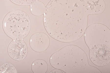 Top view of liquid cosmetics gel with bubbly structure on pastel background.Good as cosmetic mockup.の写真素材