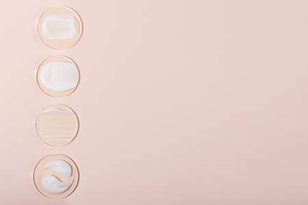 Top view of the cosmetic cream on the acrylic podiums, different swatches.Pastel colors, copy space.Good as cosmetics mockup.Vertical photography.の写真素材