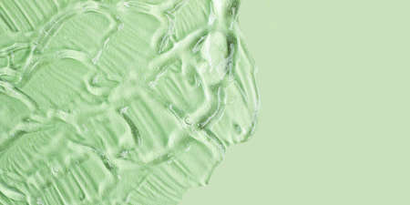 Background from textured cosmetic gel with bubbles.Top view,antibacterial liquid surface.Good as...