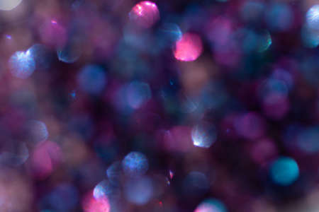 Abstract defocused blue background with shining glitter.Good as overlay layer.の写真素材