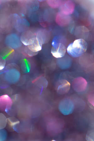 Abstract defocused multicolored background with shining glitter.Good as overlay layer.