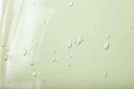 Closeup photography of green cosmetics gel with bubbly structure.