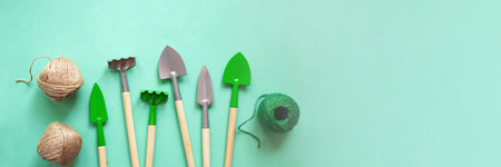 Top view of gardening tools and rope.House plant care concept,frame from tools,large banner.の写真素材
