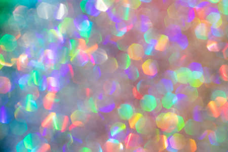 Abstract defocused multicolored background with shining glitter.Good as overlay layer.