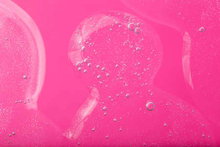 Top view of liquid cosmetics gel with bubbly structure on pink background.Good as cosmetic mockup.の写真素材